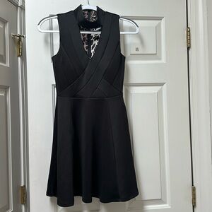 Gorgeous black dress with high neck and open at the chest